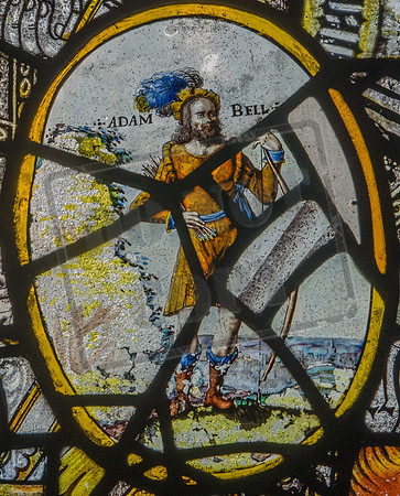 Adam Bell was said to have been one of a band of outlaws living in Inglewood Forest, near Carlisle: C17 Flemish fragment from Quedgeley Manor, now in St Mary's, Bromsberrow, Gloucestershire