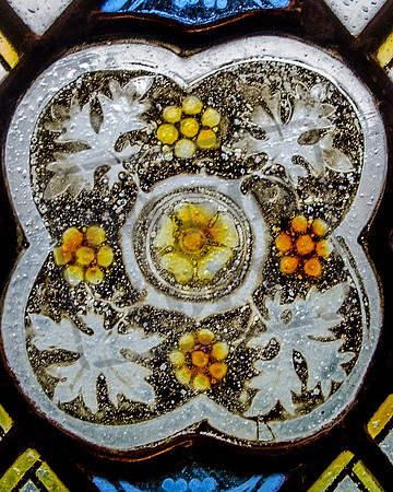 Mediaeval stained glass fragment reset (1931) in window of Gloucester Cathedral Cloisters, South Walk