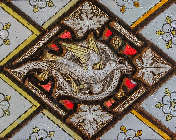 Mediaeval stained glass fragment reset (1931) in window of Gloucester Cathedral Cloisters, South Walk