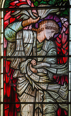The Angel of Victory - one of three figures by Morris and Co., 1912, in the East window of the church of St Katharine, Wormington, Gloucestershire