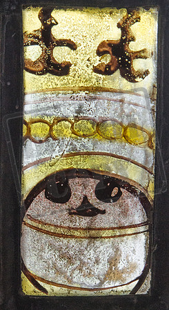 Mediaeval glass fragment in the church of St Katharine, Wormington, Gloucestershire