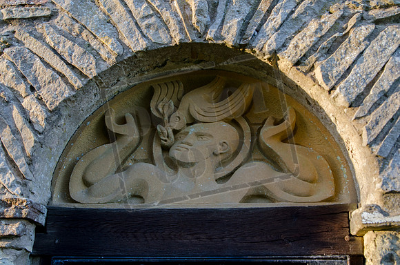 "Noah welcoming the return of the dove", by John Bunting, above the entrance to his Memorial Chapel, North Yorkshire